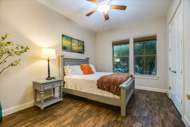 a bedroom with a bed and a window