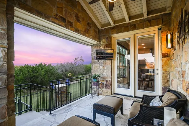 a view of a field with some trees in the background
