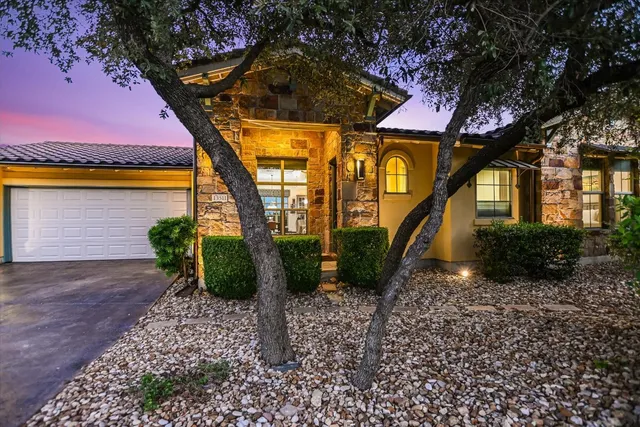 a pathway of a house with a yard