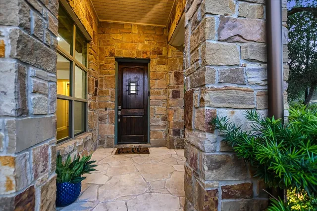 a view of backyard with swimming pool and seating space