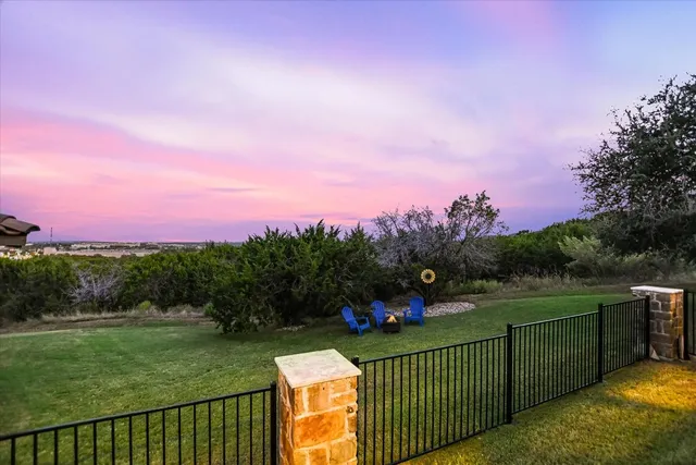 a view of a street with a garden