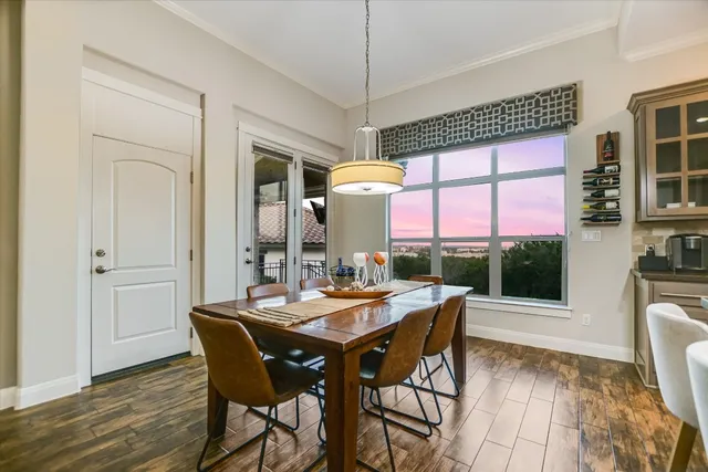 a view of a dining room with furniture window and outside view