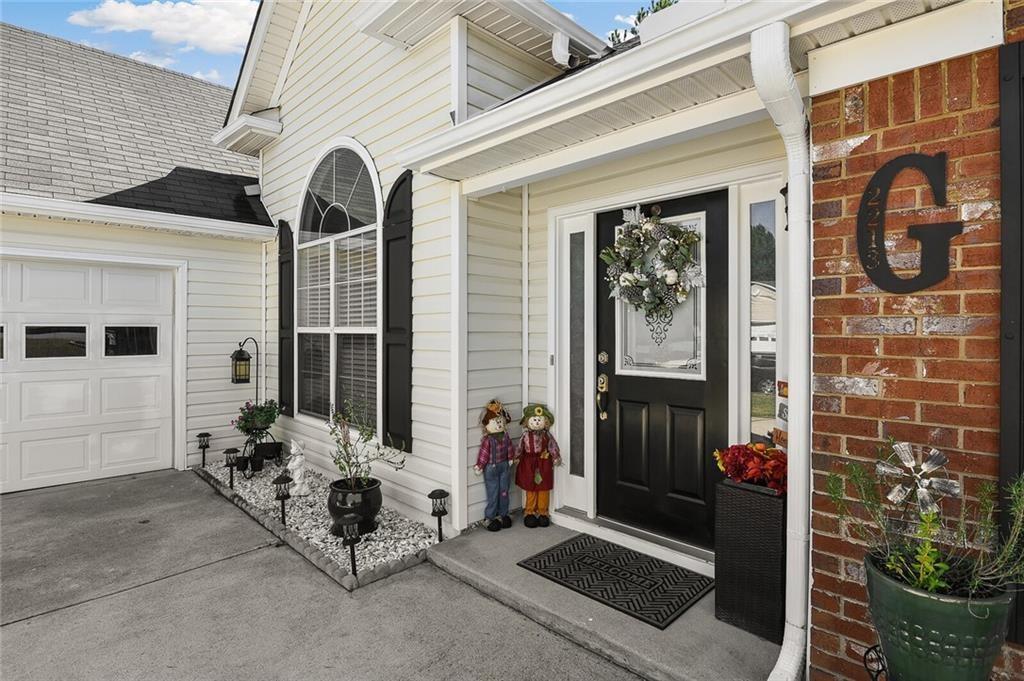 2213 Carlton Chase Road Dacula, GA 30019 - Photo 4 of 30 a view of a porch with seating space
