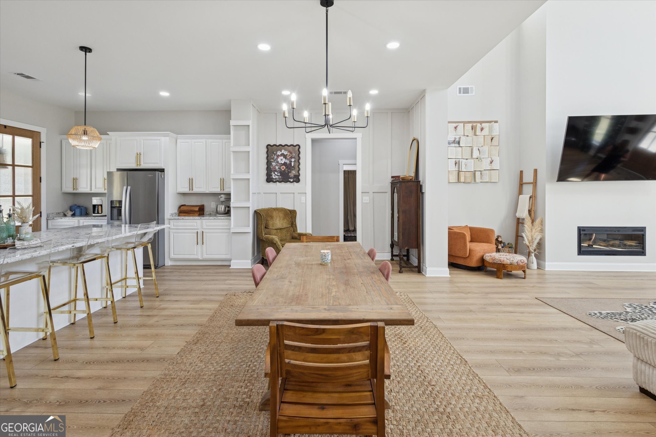 4031 Mud Road Brooklet, GA 30415 - Photo 13 of 49 a living room with kitchen island furniture and a chandelier