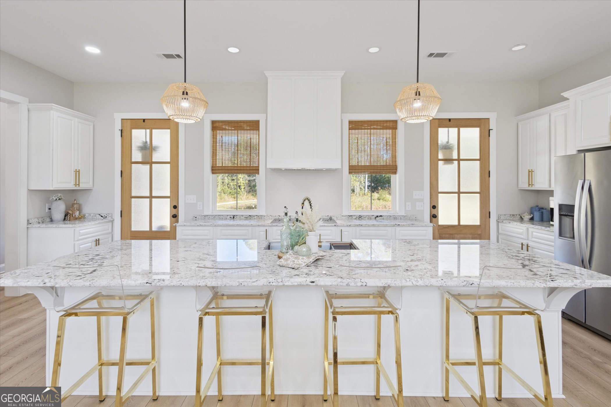 4031 Mud Road Brooklet, GA 30415 - Photo 14 of 49 a kitchen with stainless steel appliances granite countertop a kitchen island hardwood floor sink stove and granite counter tops