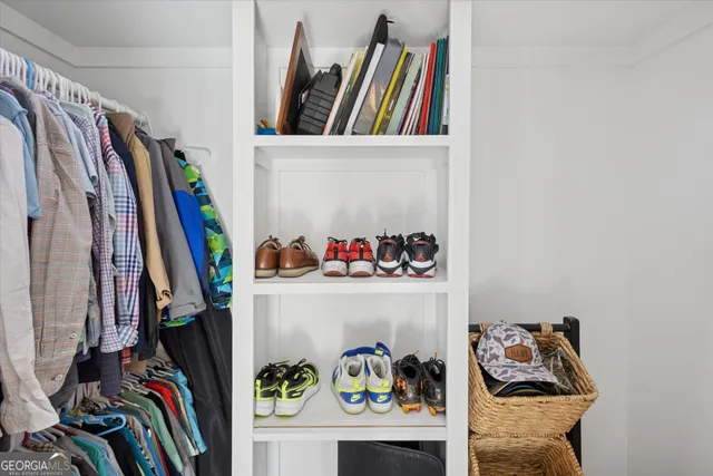 a view of a closet with storage