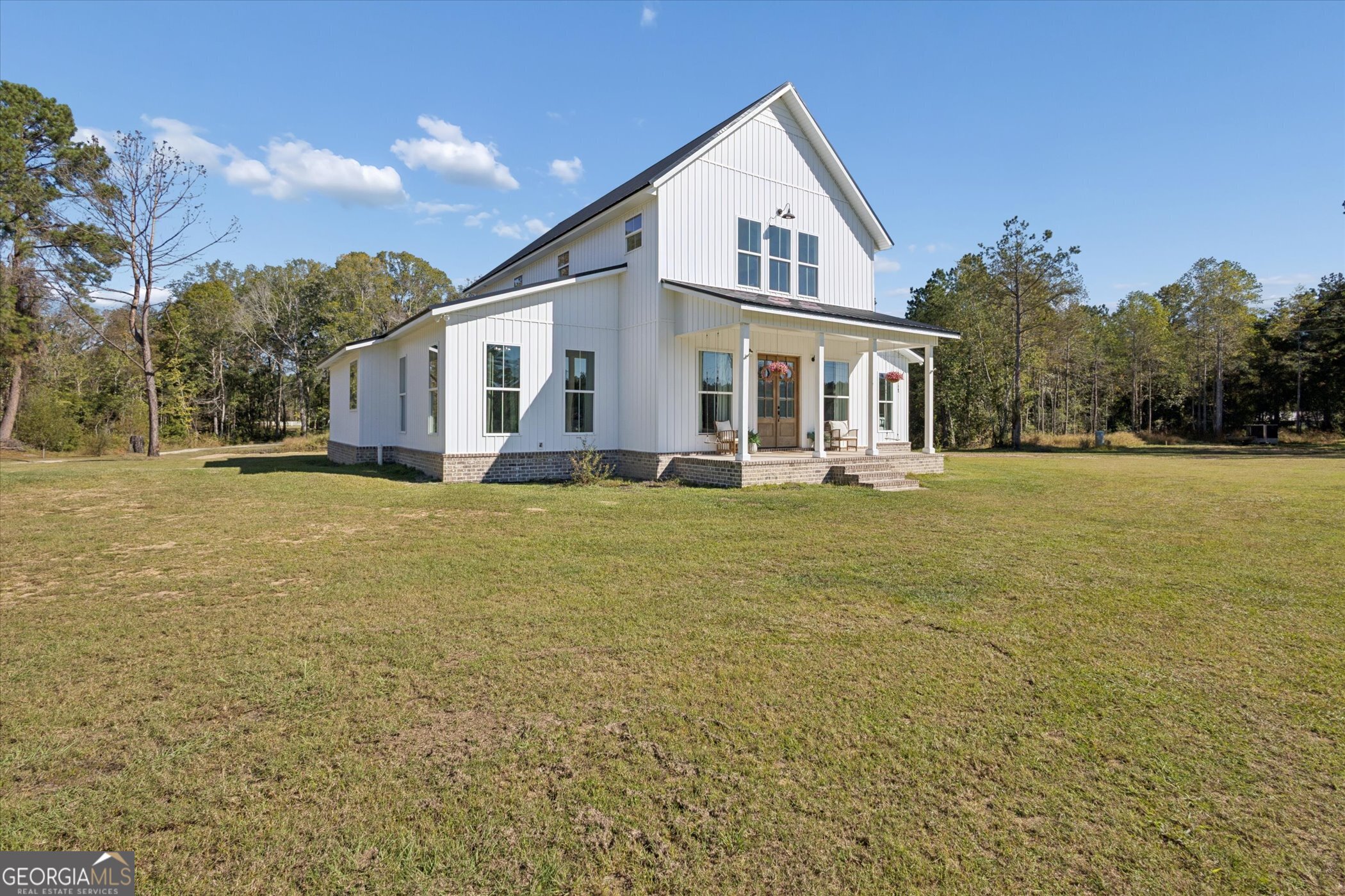 4031 Mud Road Brooklet, GA 30415 - Photo 4 of 49 a front view of house with yard and trees in the background