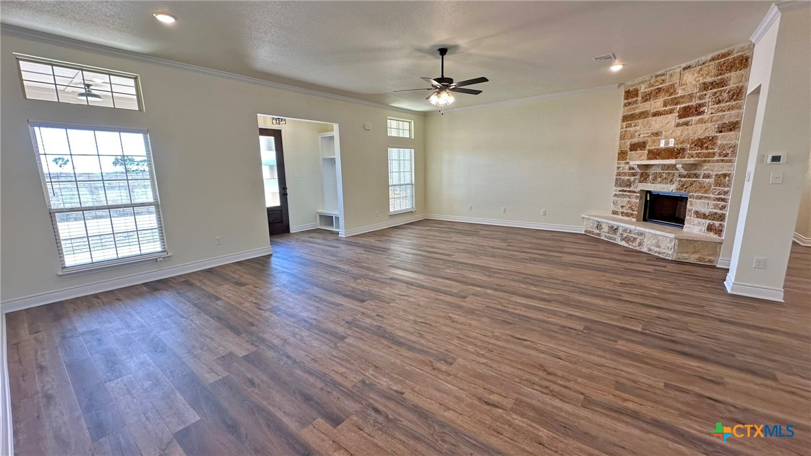 4237 Cool Basin Road Kempner, TX 76539 - Photo 16 of 36 a view of an empty room with wooden floor and a window