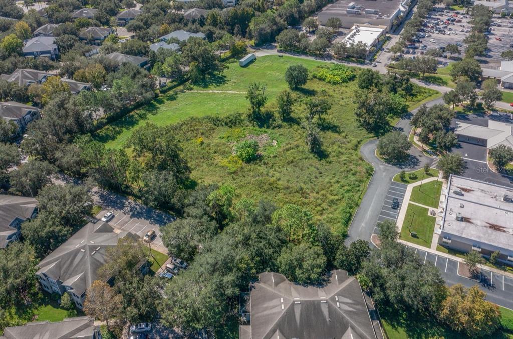 5350 Southwest College Road Ocala, FL 34474 - Photo 5 of 6 an aerial view of a house with a yard and outdoor seating
