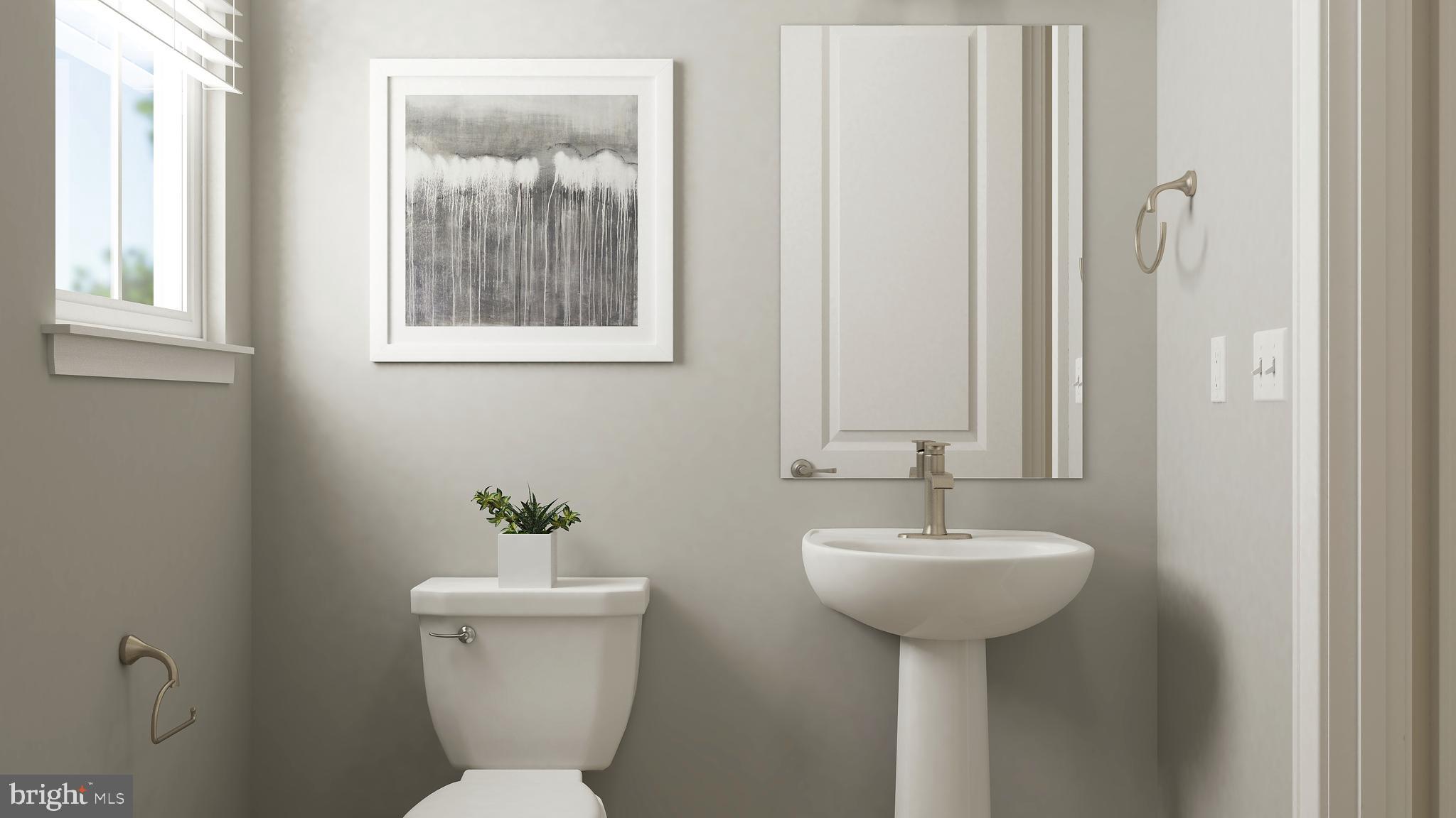 106 Stilly Way Annapolis, MD 21403 - Photo 7 of 17 a bathroom with a toilet a sink and a window