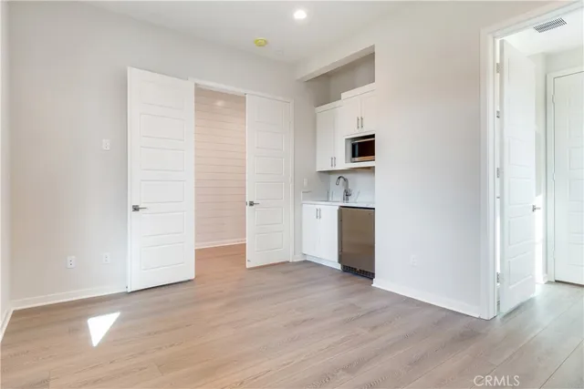 a kitchen with a sink and a microwave