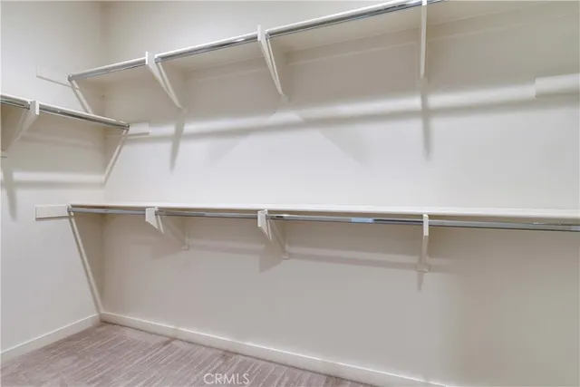 a view of an empty walk in closet