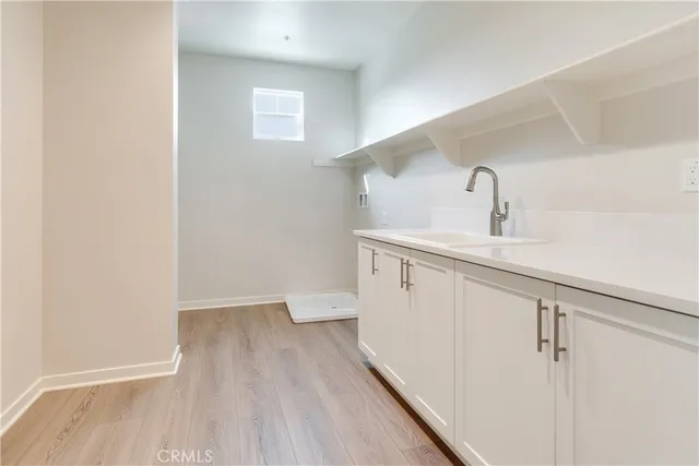 a white toilet sitting next to a bath tub