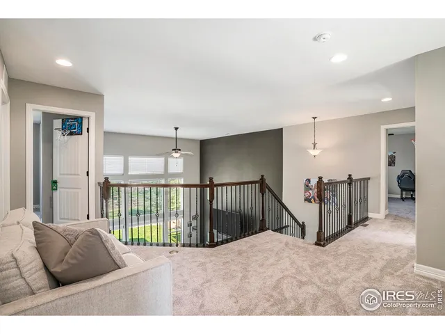 a view of a bedroom with furniture and windows
