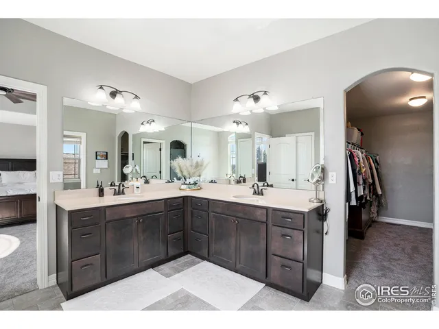 a spacious bathroom with a sink vanity and mirror
