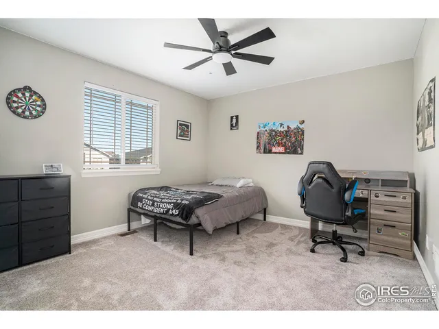 a bedroom with furniture and a window
