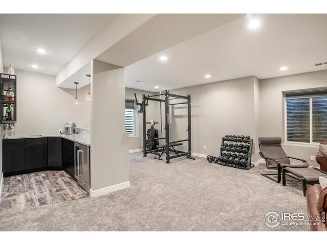 a room with gym equipment and a large window