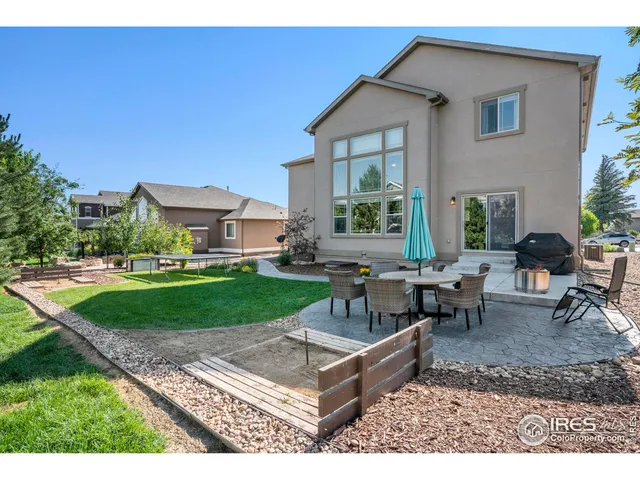 a house view with a sitting space and garden