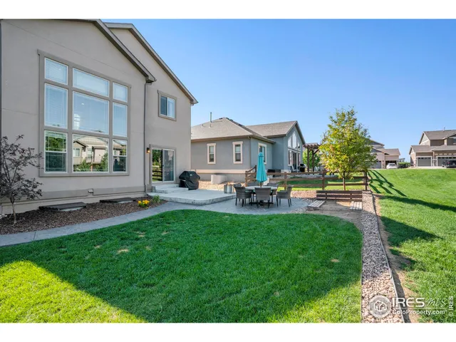 a house view with swimming pool and sitting space