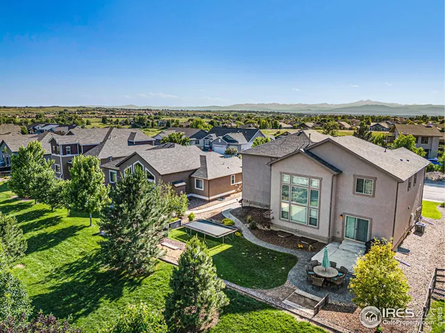 an aerial view of a house with a garden