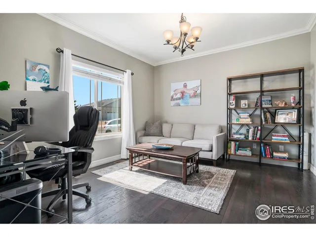 a living room with furniture a piano and a flat screen tv