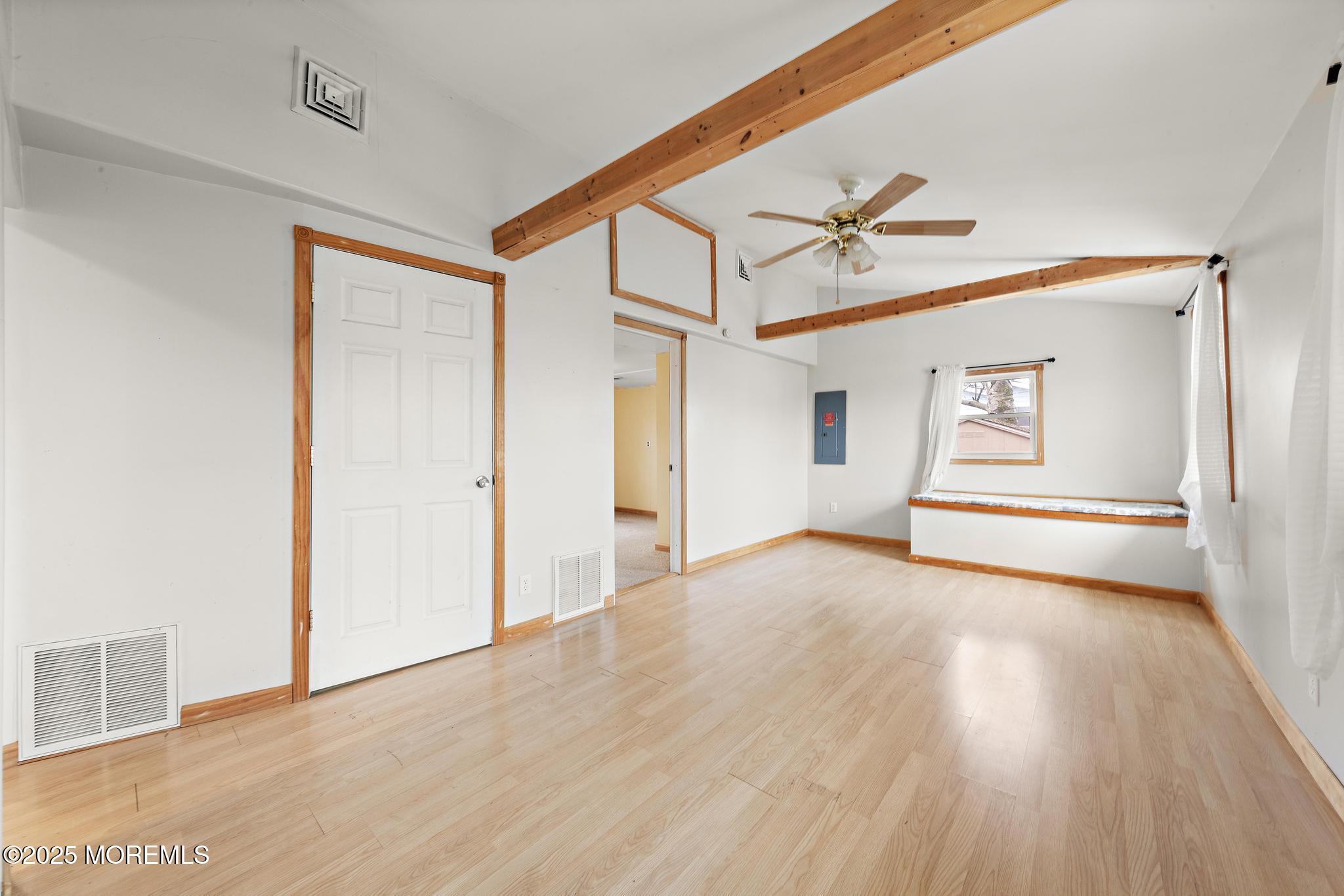 73 Dolphin Road Tuckerton, NJ 08087 - Photo 7 of 44 a view of a room with wooden floor and white walls