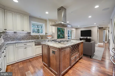 a kitchen with a stove and a sink
