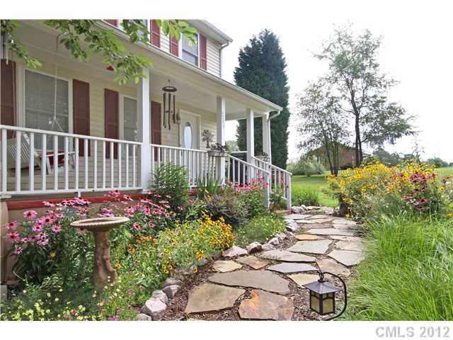 6200 Wright Road Kannapolis, NC 28081 - Photo 5 of 11 a view of a house with a flower garden