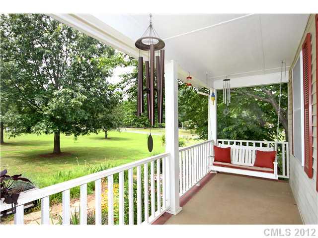6200 Wright Road Kannapolis, NC 28081 - Photo 6 of 11 a porch with a yard table and chairs