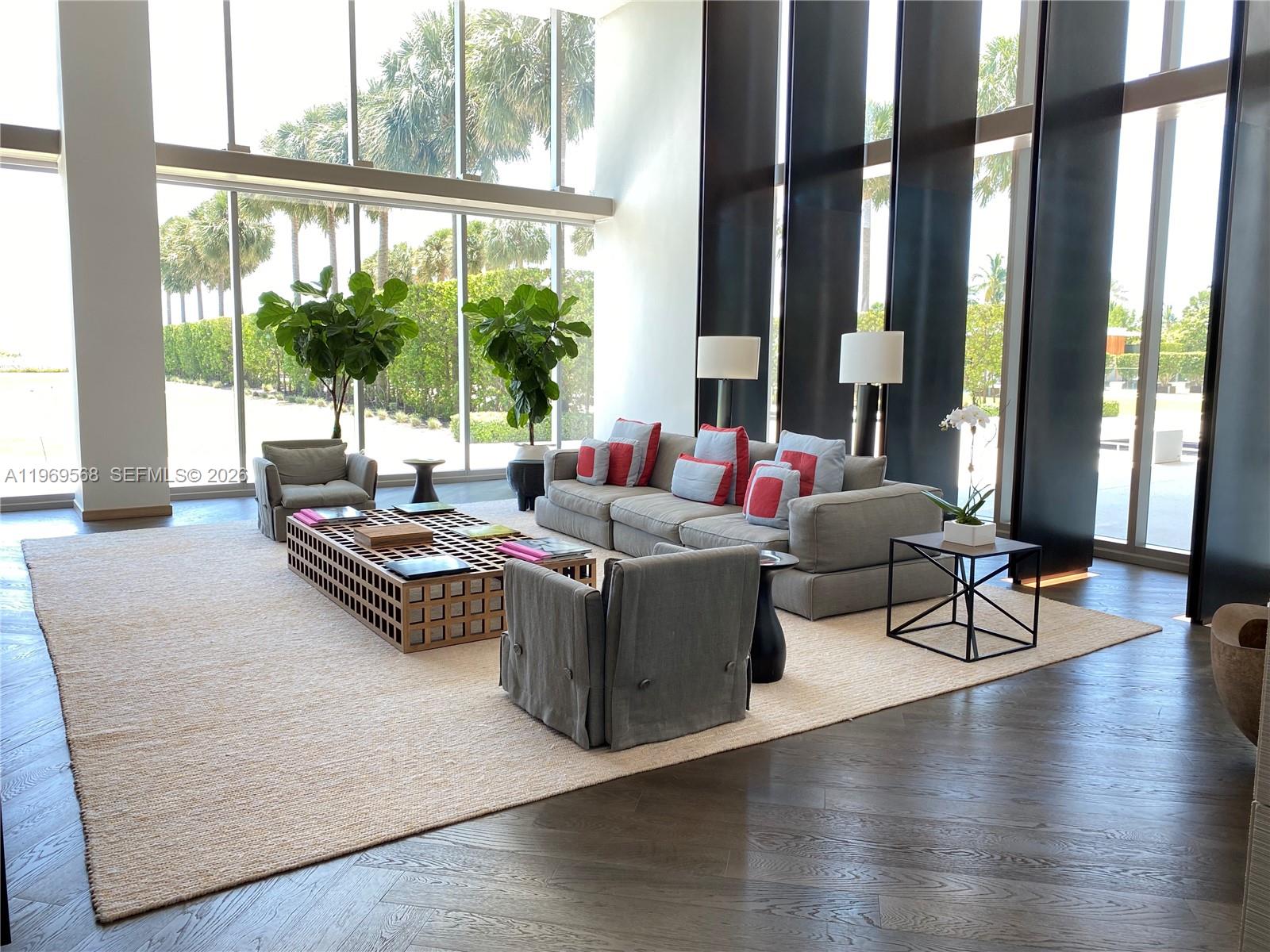 350 Ocean Drive, Unit 406N Key Biscayne, FL 33149 - Photo 36 of 41 a living room with furniture and large windows