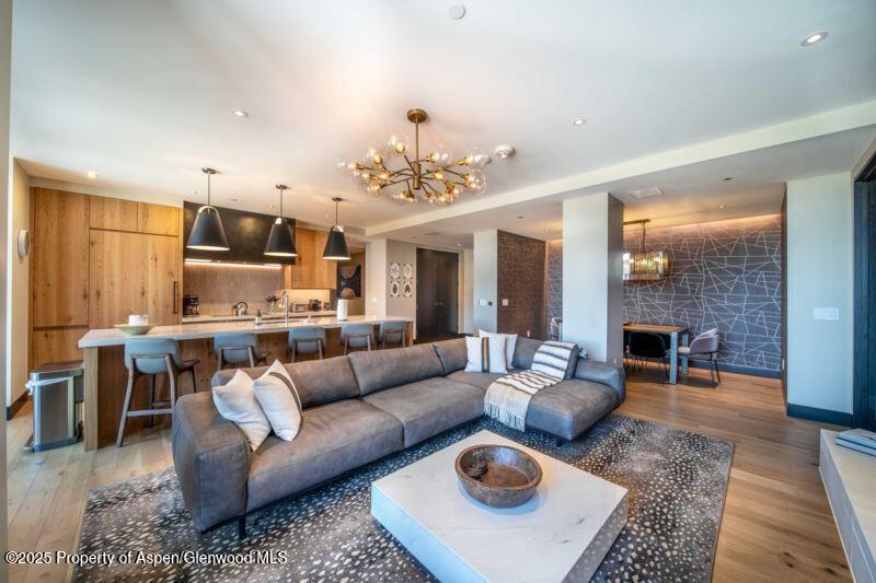 77 Wood Road, Unit 303 Snowmass Village, CO 81615 - Photo 5 of 43 a living room with furniture and view of kitchen
