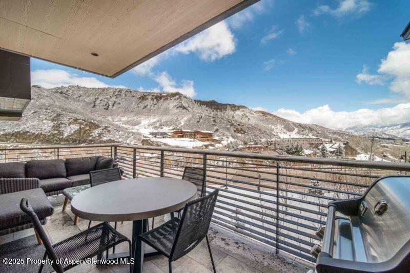 77 Wood Road, Unit 303 Snowmass Village, CO 81615 - Photo 7 of 43 a view of a balcony with chairs