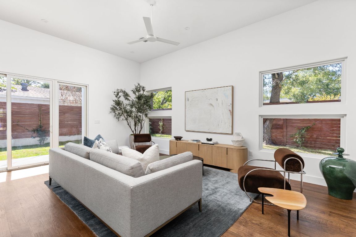 127 Frederick Street Austin, TX 78704 - Photo 11 of 35 a living room with furniture and a floor to ceiling window