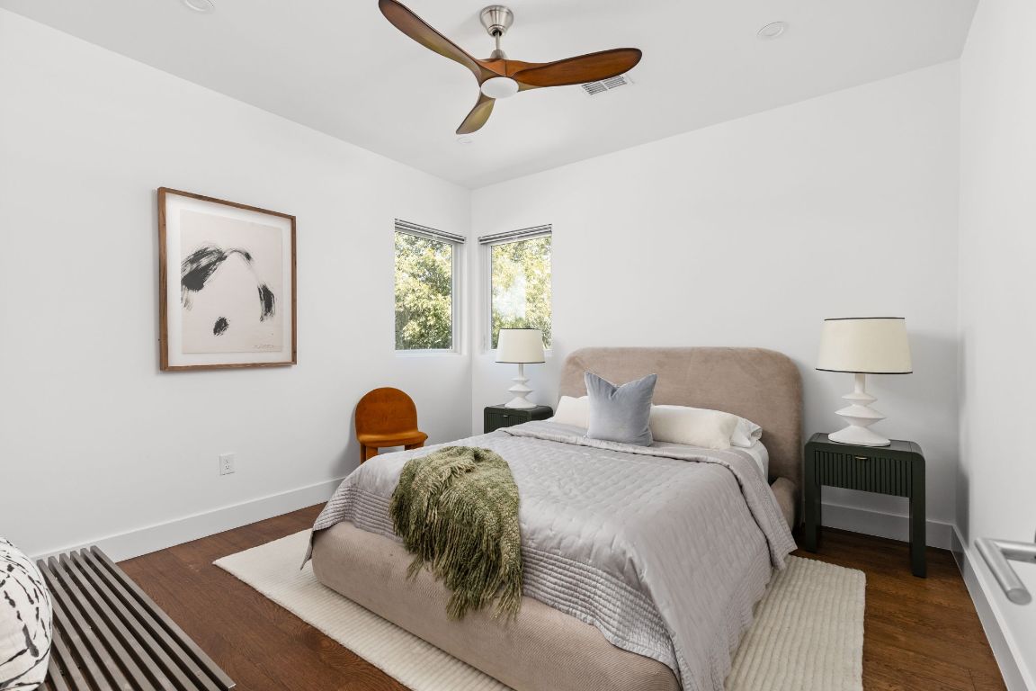 127 Frederick Street Austin, TX 78704 - Photo 26 of 35 a bedroom with a bed and wooden floor