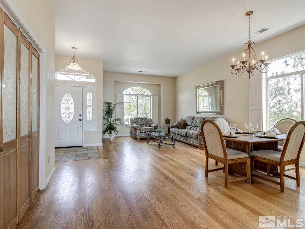 1114 University Ridge Drive Reno, NV 89512 - Photo 3 of 25 a view of a livingroom with furniture window and wooden floor