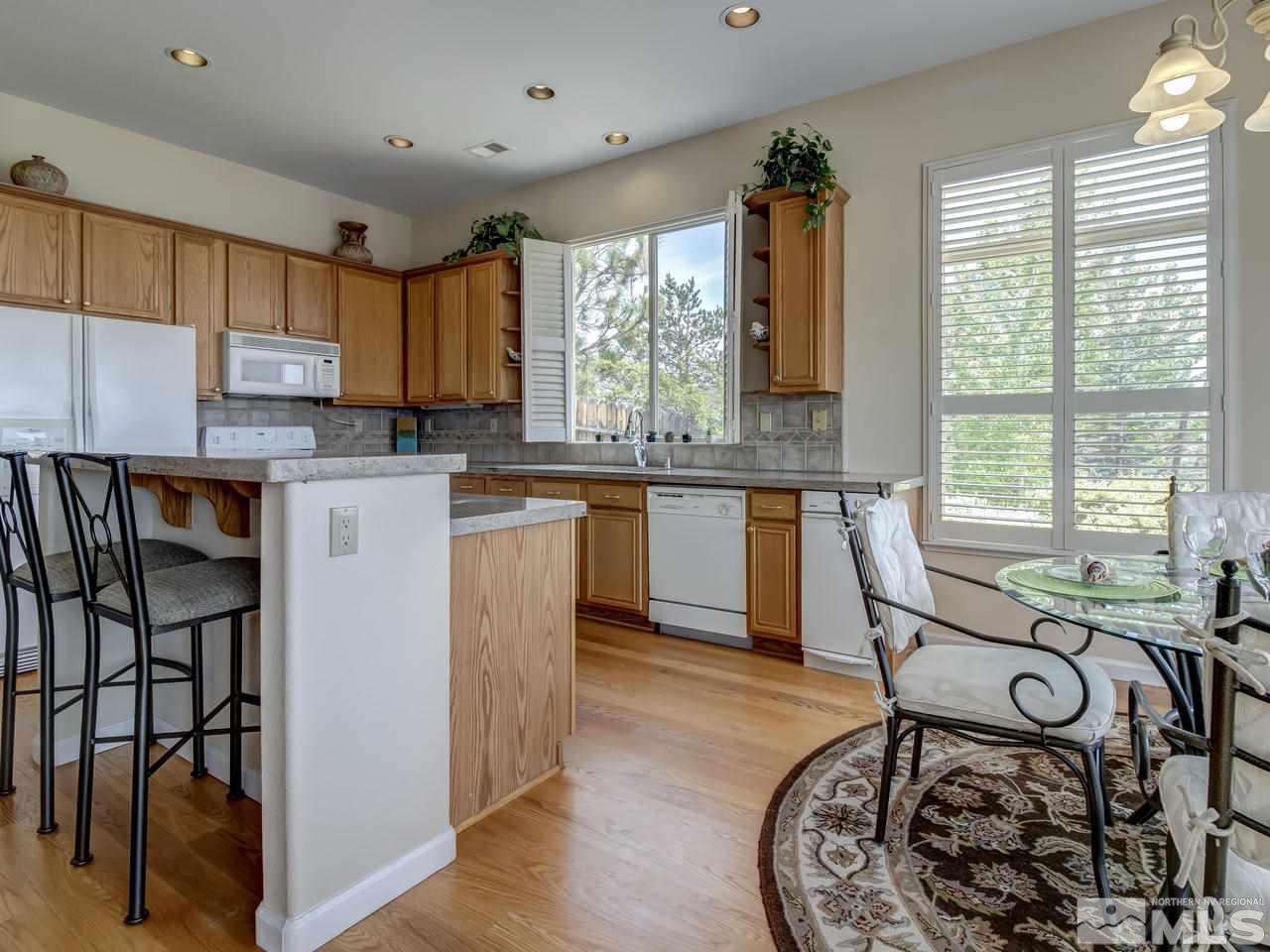 1114 University Ridge Drive Reno, NV 89512 - Photo 8 of 25 a view of a kitchen and dining room