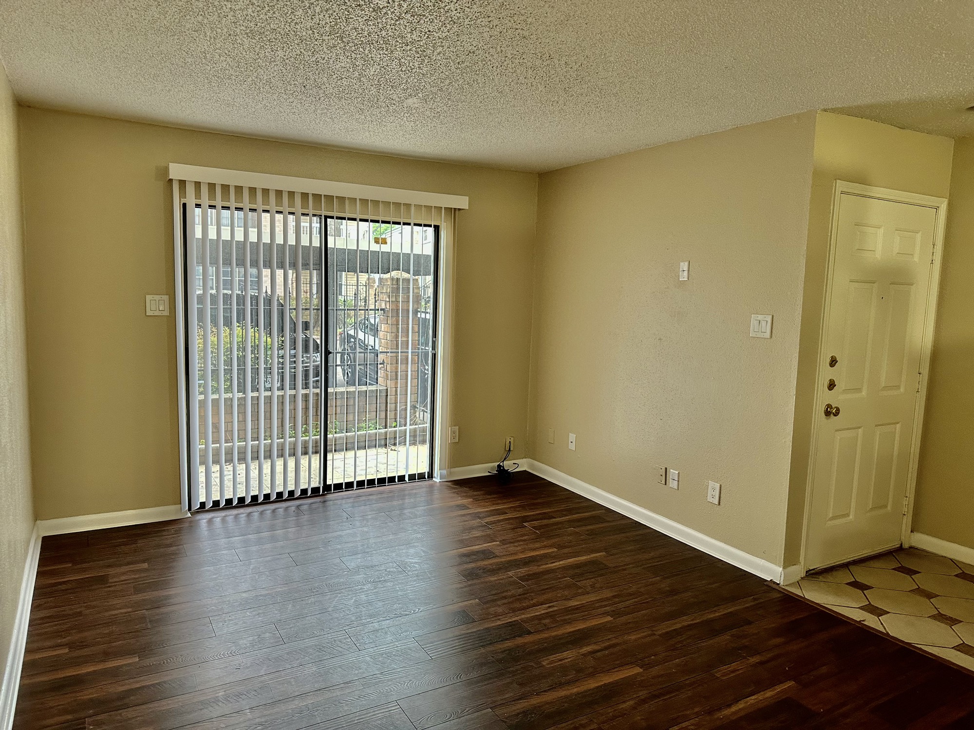 2750 Holly Hall Street, Unit 703 Houston, TX 77054 - Photo 1 of 20 OCCUPIED TIL SEPT 30TH.
Living area with sliding doors to the patio area