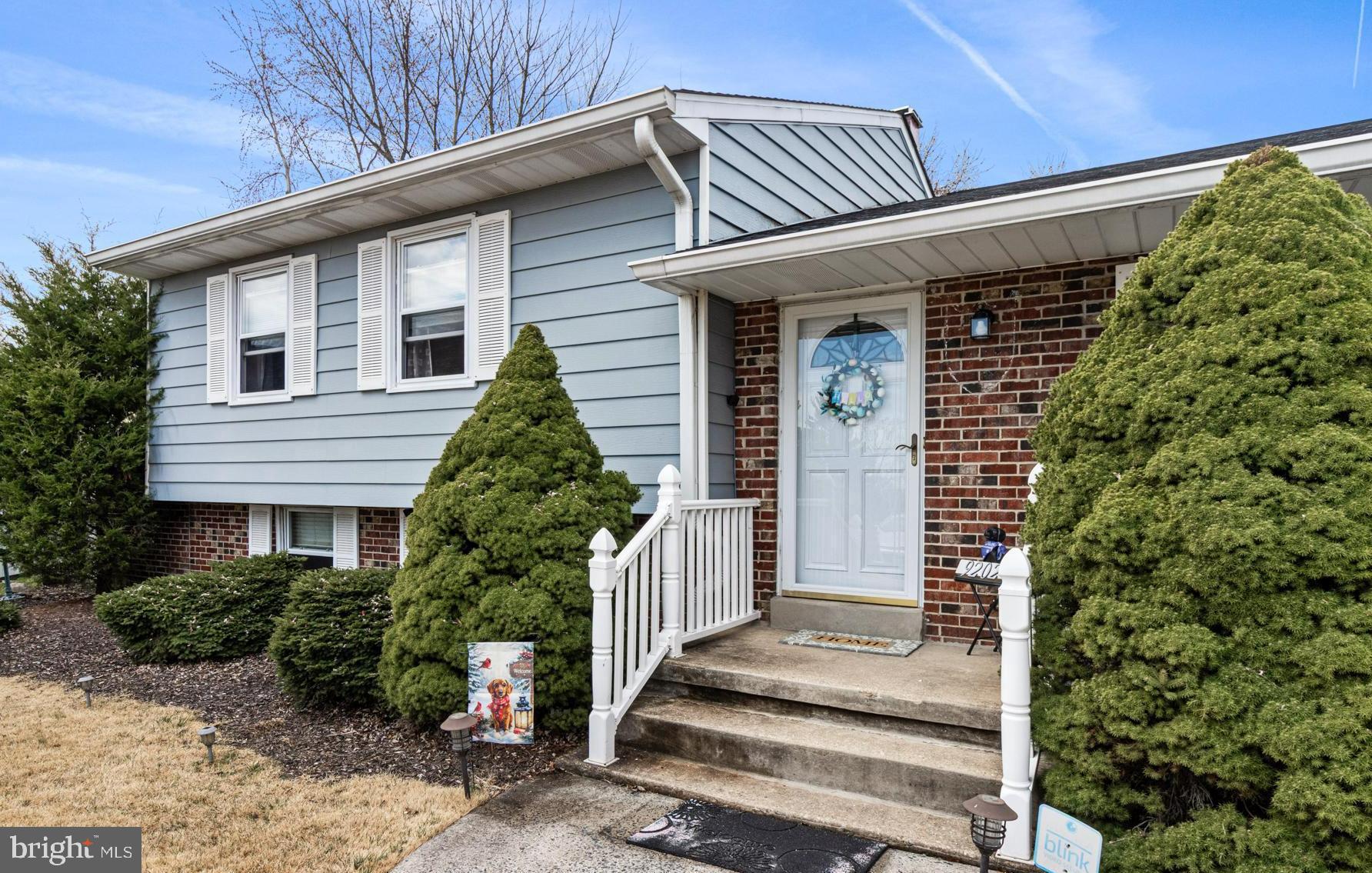 9202 Santa Rita Road Baltimore, MD 21236 - Photo 2 of 50 a front view of a house with a yard