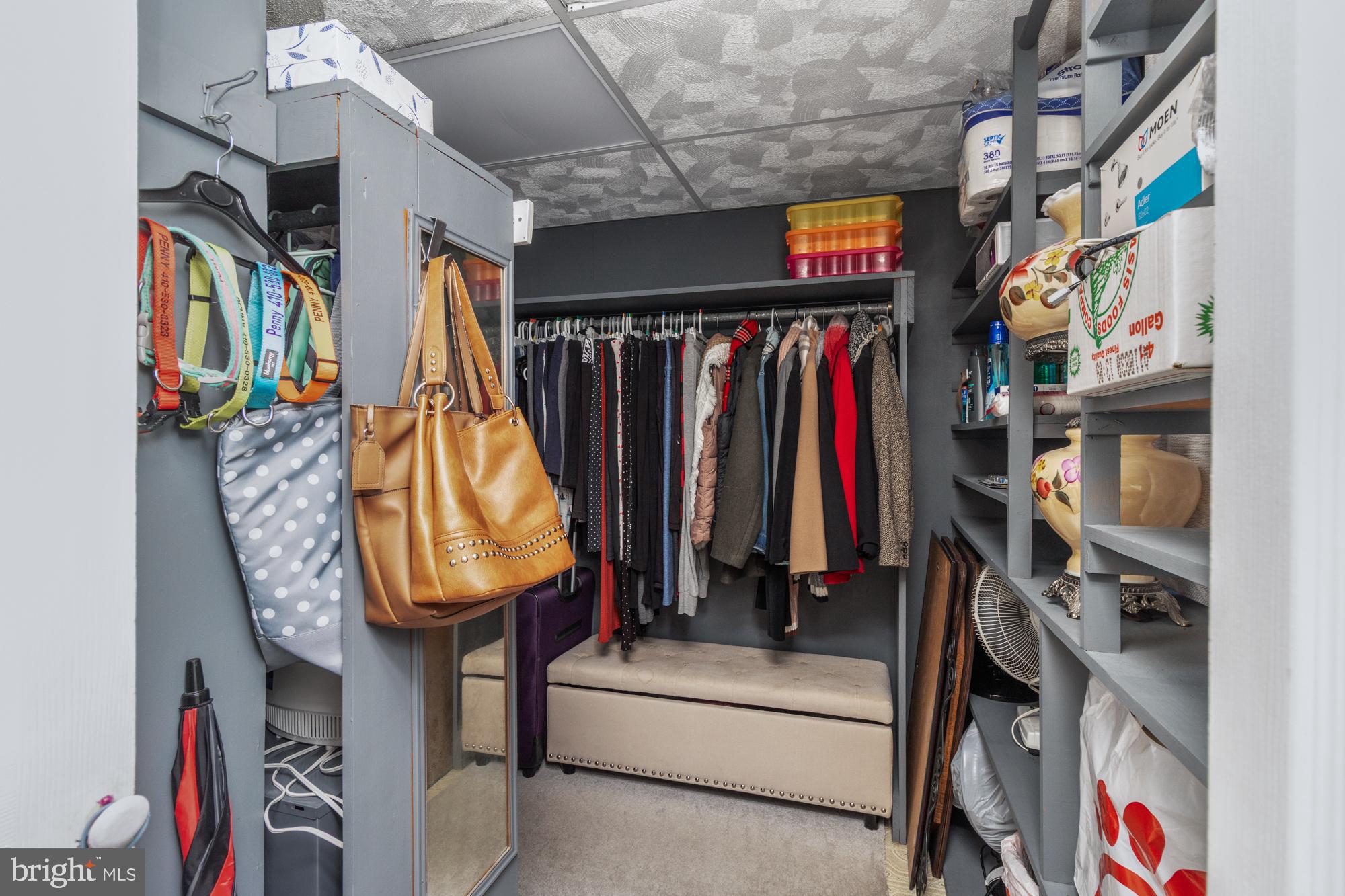 9202 Santa Rita Road Baltimore, MD 21236 - Photo 22 of 50 a view of walk in closet with clothes and shoes
