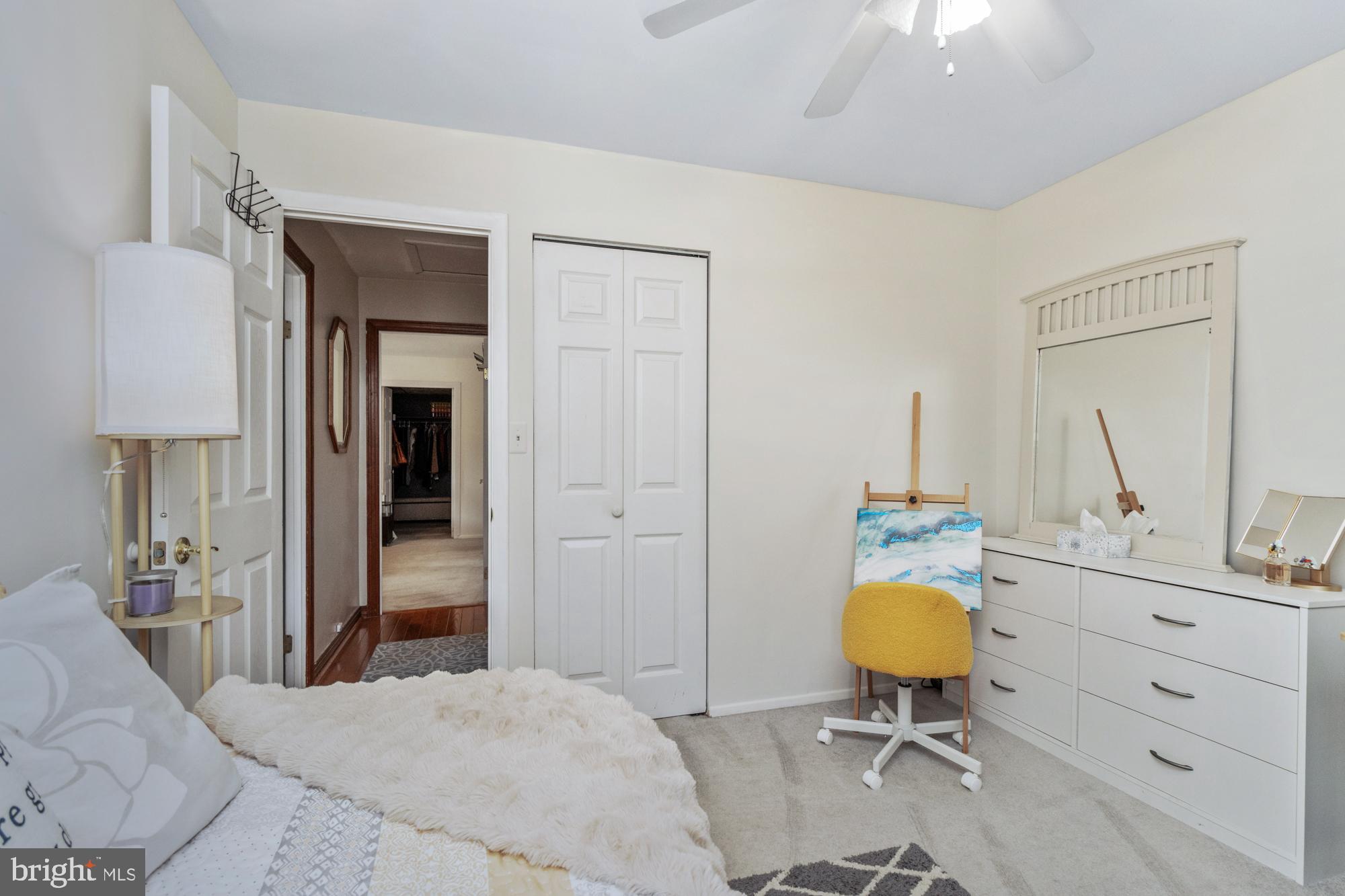 9202 Santa Rita Road Baltimore, MD 21236 - Photo 27 of 50 a bedroom with a bed and a chandelier