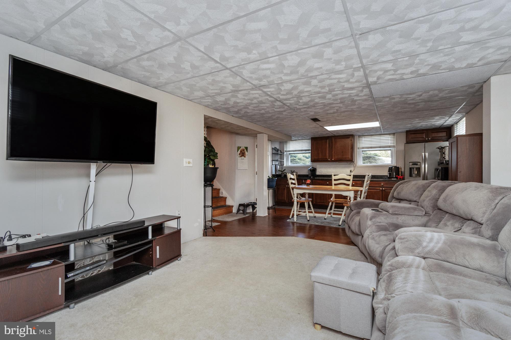 9202 Santa Rita Road Baltimore, MD 21236 - Photo 31 of 50 a living room with furniture and a flat screen tv