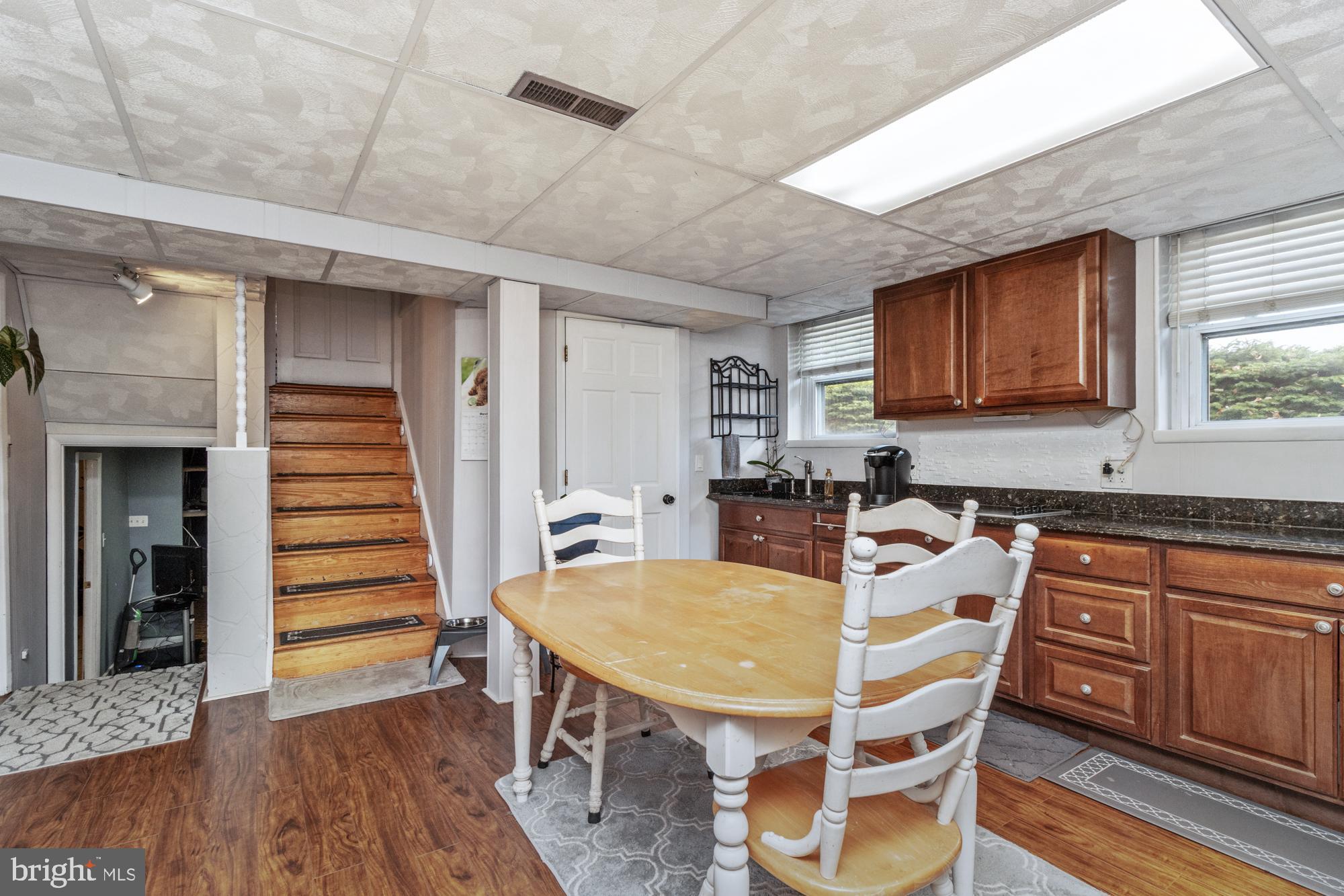 9202 Santa Rita Road Baltimore, MD 21236 - Photo 34 of 50 a view of a dining room with furniture and wooden floor