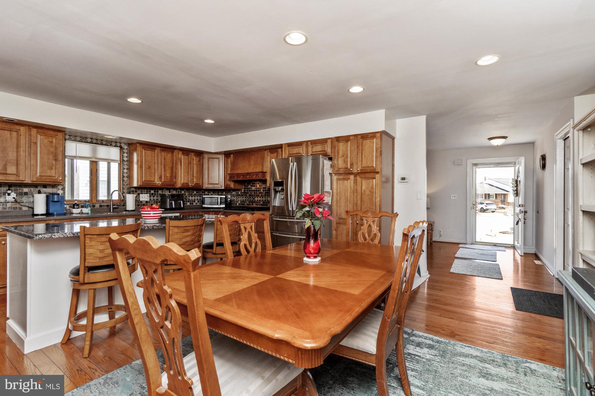9202 Santa Rita Road Baltimore, MD 21236 - Photo 8 of 50 a view of a dining room with furniture window and wooden floor