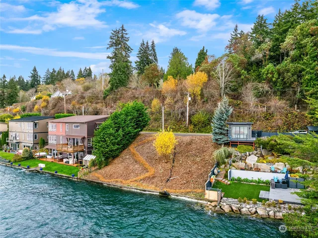 a view of a house with a big yard and potted plants