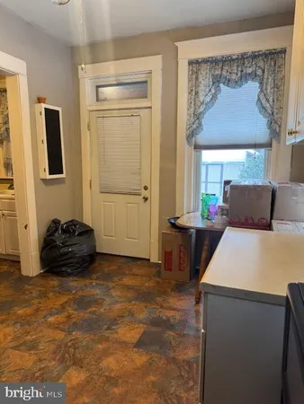 a bedroom with a bed and a mirror