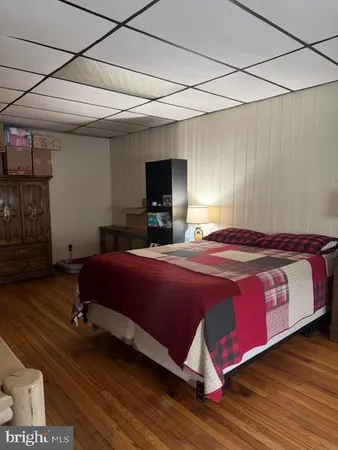 a view of a workspace with furniture and a kitchen