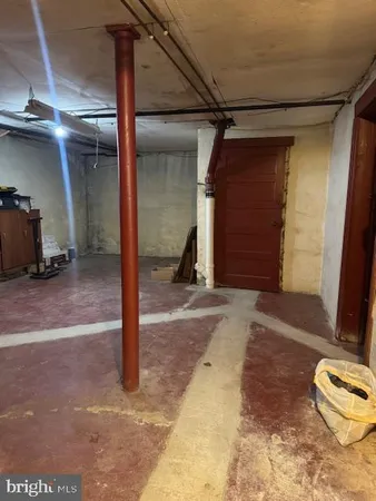 a view of walk in closet with clothes