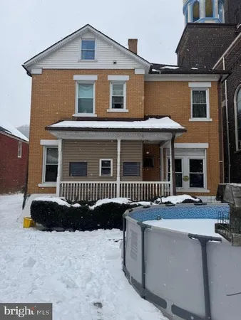 a backyard of a house with seating space