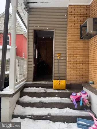 a view of a terrace with chairs and potted plants