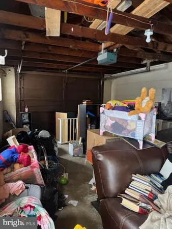 a view of room with furniture and wooden floor